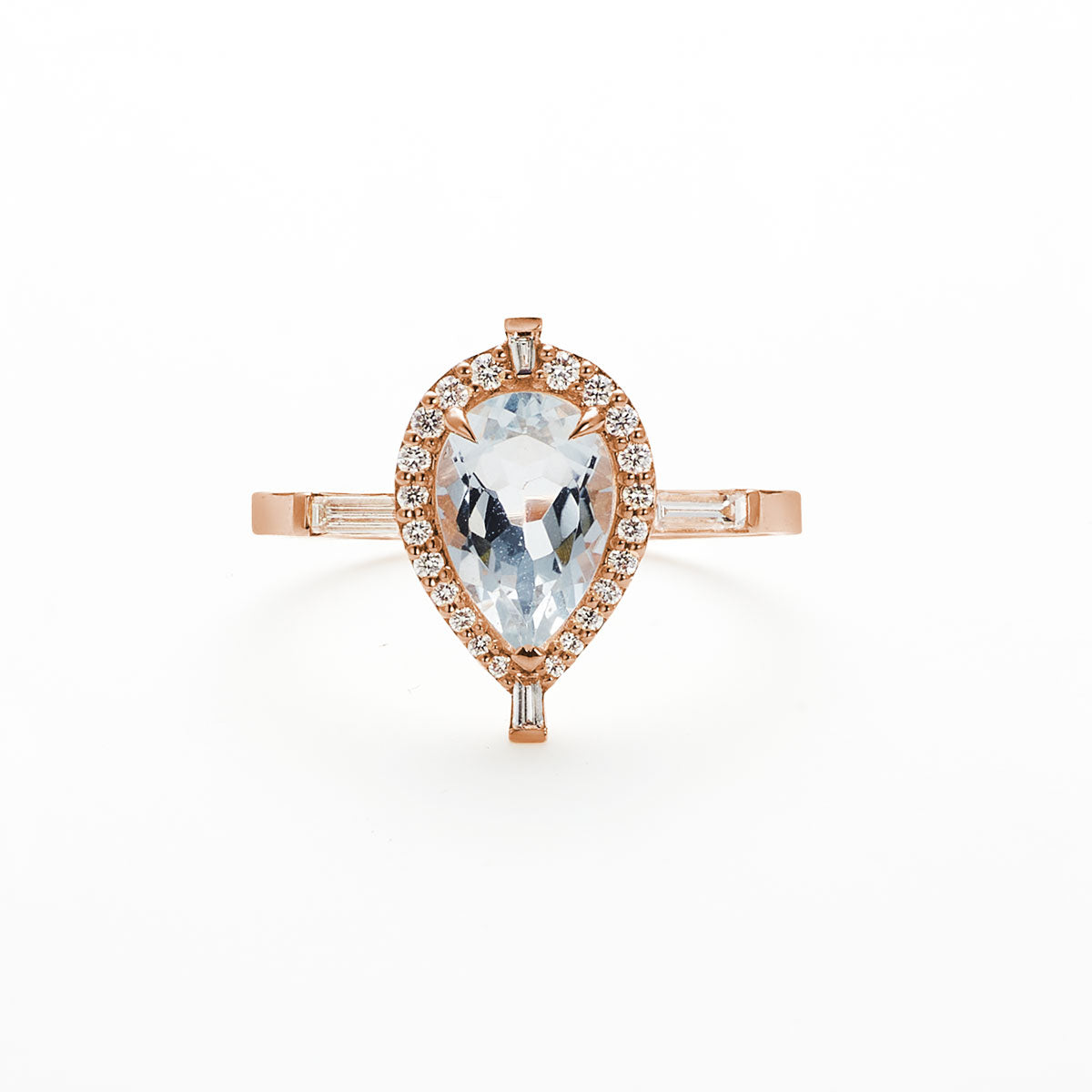 Pear shaped aquamarine diamond Marchesa ring on white background.