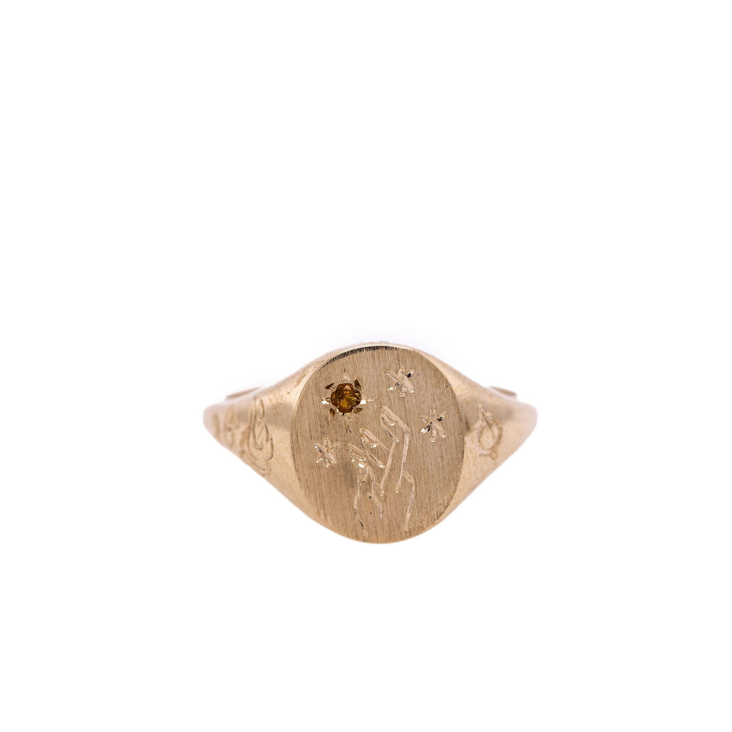 Citrine Hand-engraved gold signet ring with intricate design on a clean white background