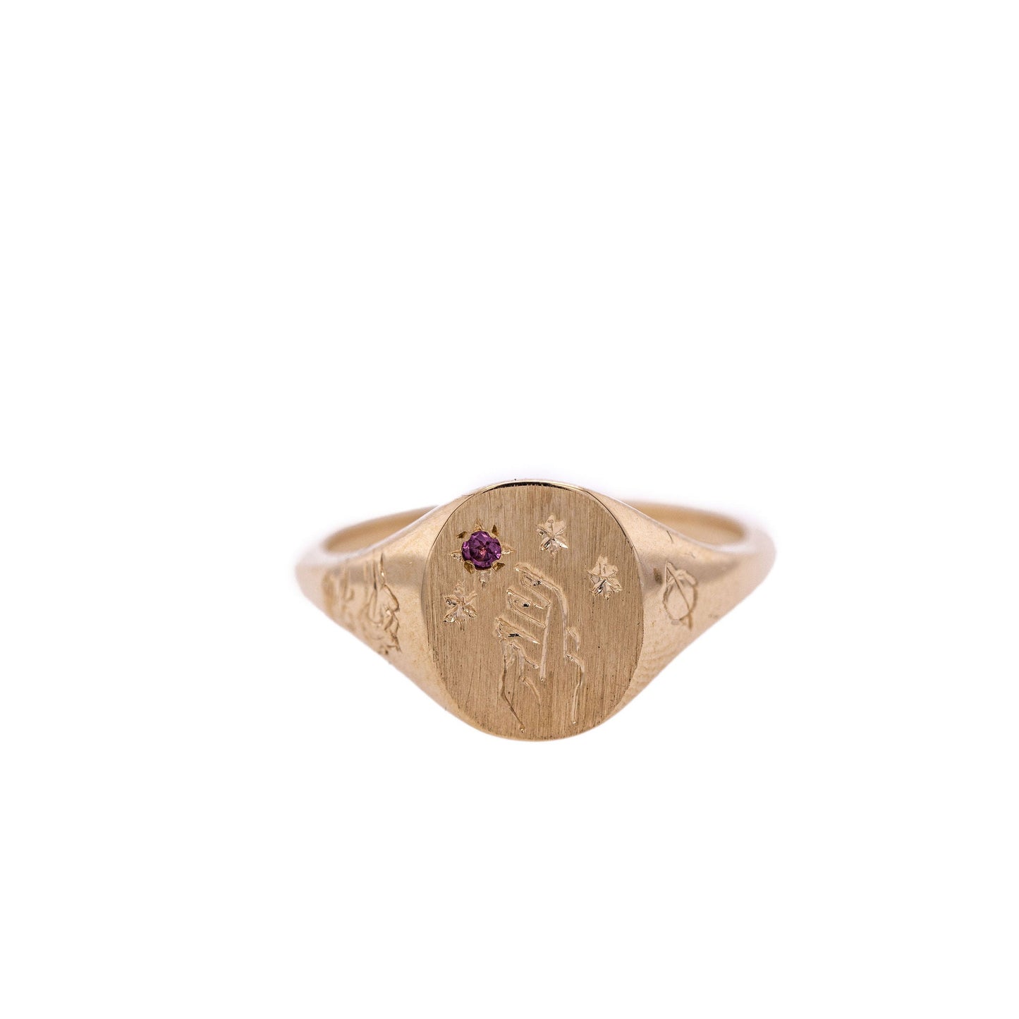 Rhodolite Garnet Hand-engraved gold signet ring with intricate design on a clean white background
