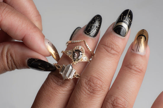 3 diamond rings on a model's hand