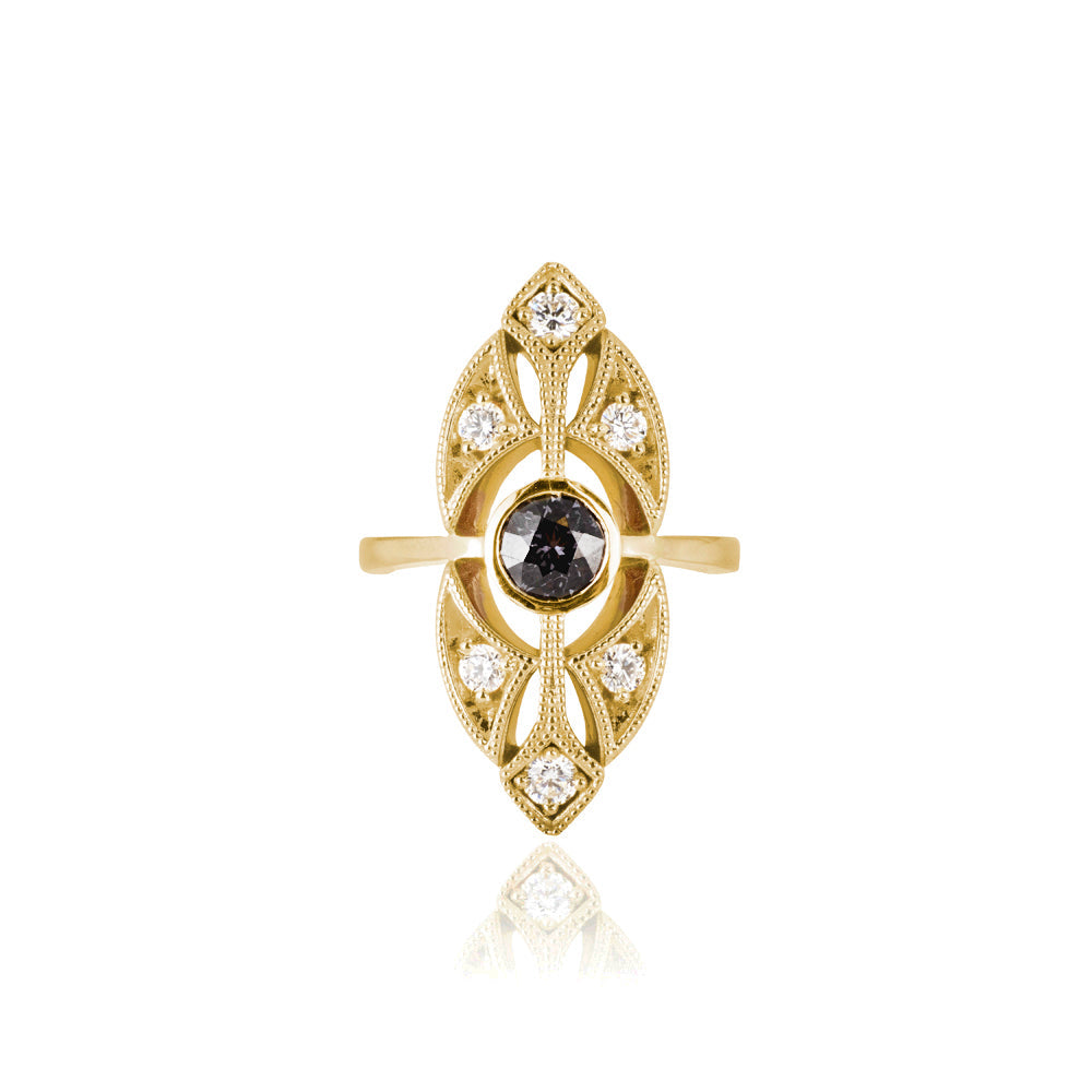 Yellow gold spinel ring with diamonds on a white background 