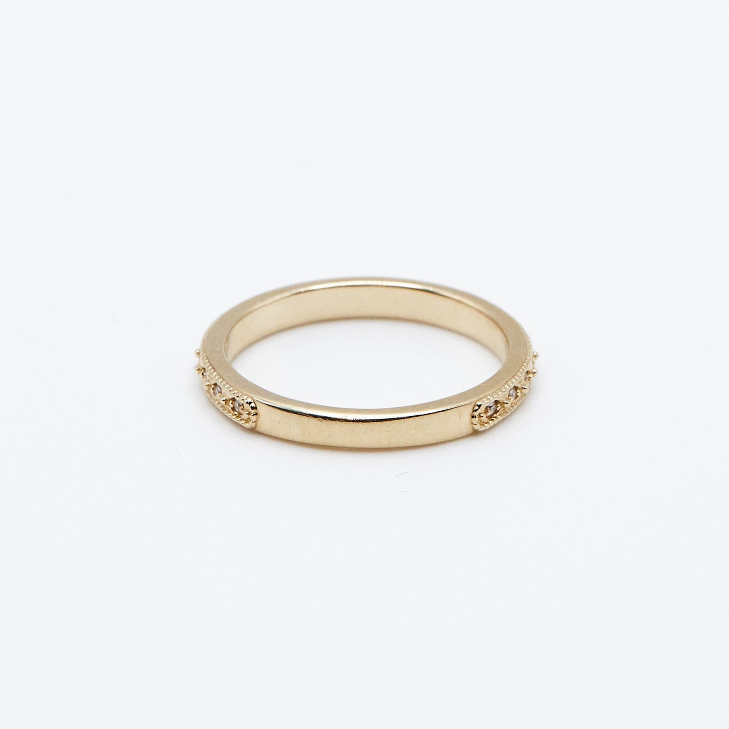 back view of the victorian diamond wedding band on white background