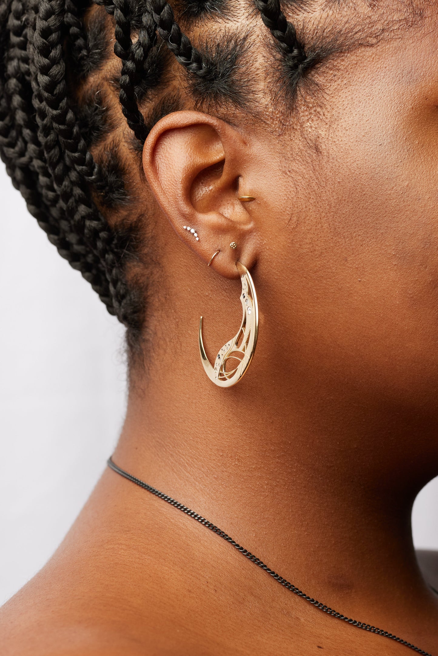 side view of model wearing the luna hoop earrings