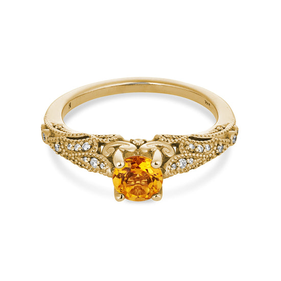 Citrine Maharaja engagement ring on white background.