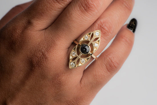 Grey spinel ring on a model's hand