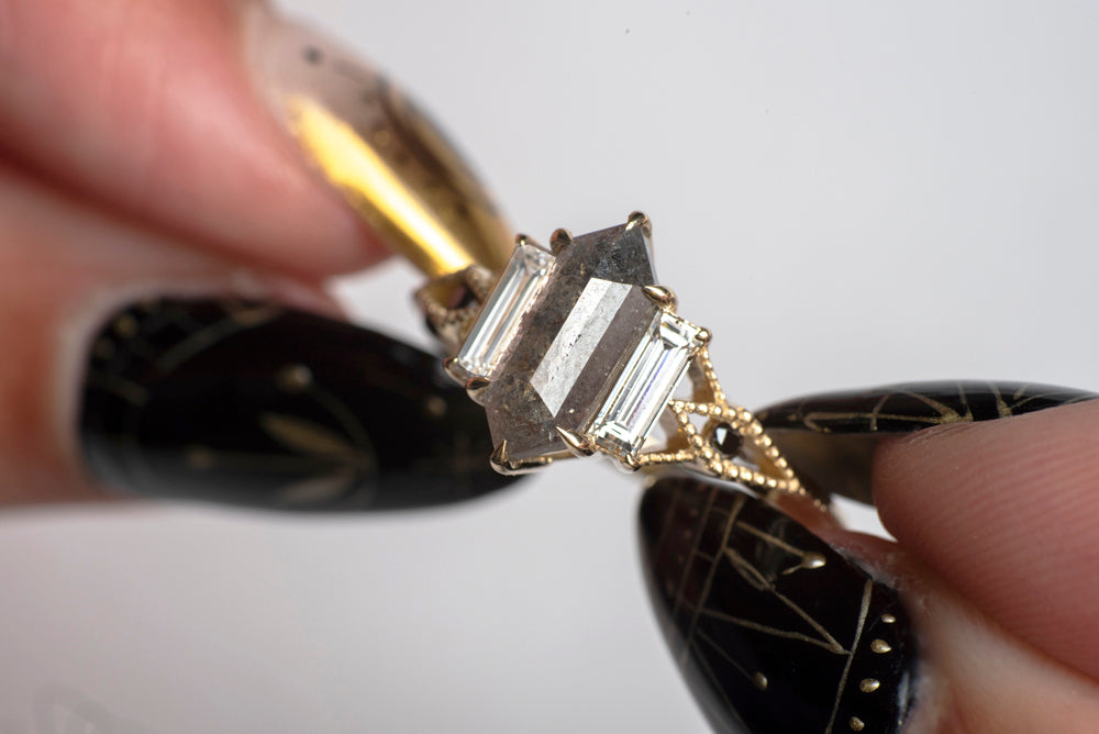 hexagon salt and pepper ring held by a model